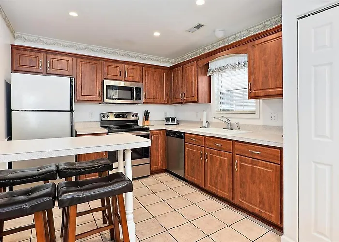 Just Steps To The Boardwalk From This 3 Bedroom Townhome!